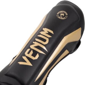 Paratibie Venum Elite Nero/Oro Made in Thailand per Muay Thai, Kickboxing e MMA