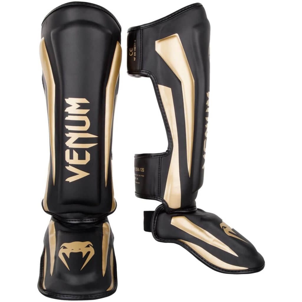 Paratibie Venum Elite Nero/Oro per Muay Thai, Kickboxing e MMA
