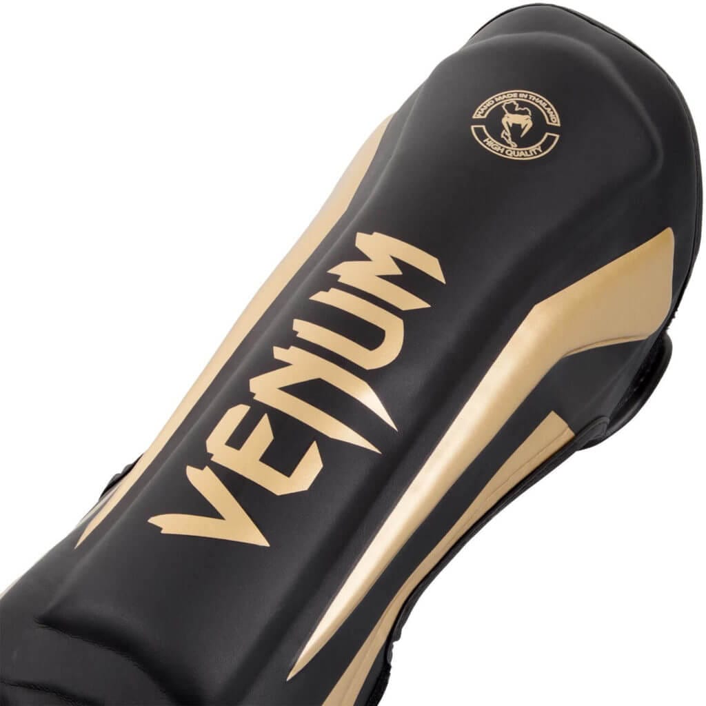 Paratibie Venum Elite Nero/Oro Made in Thailand per Muay Thai, Kickboxing e MMA