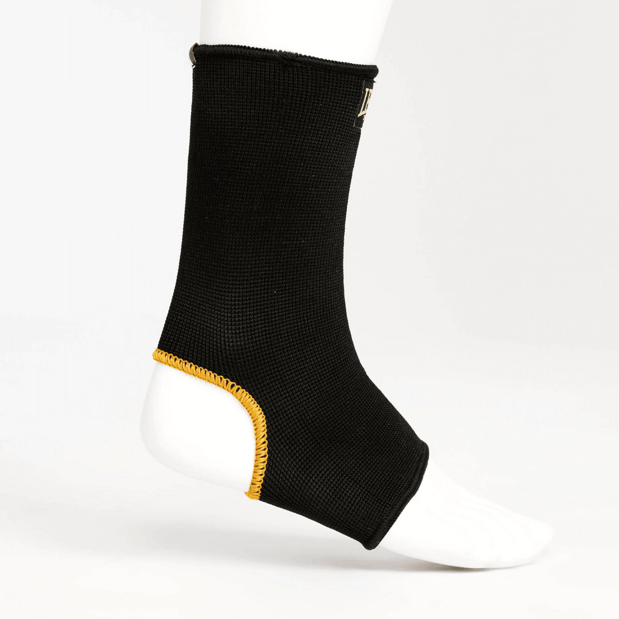 Cavigliere Kickboxing/Muay Thai DNA Leone 1947 Nero/Oro per allenamenti e match. Sostegono l'articolazione e aiutano a stabilizzare la caviglia durante gli allenamenti o i match.