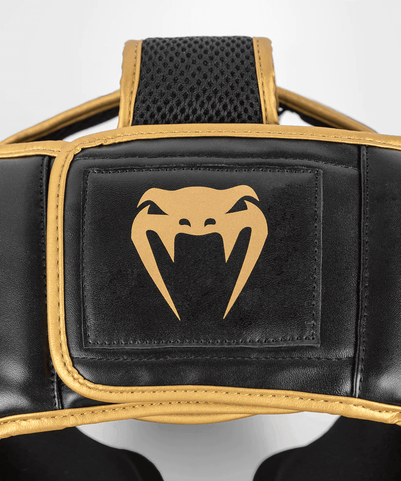 Caschetto Sparring Venum Challenger Nero/Oro con parazigomi e paramento per allenamenti di Boxe, Kickboxing, Muay Thai ed MMA. Taglia unica, si adatta facilmente.