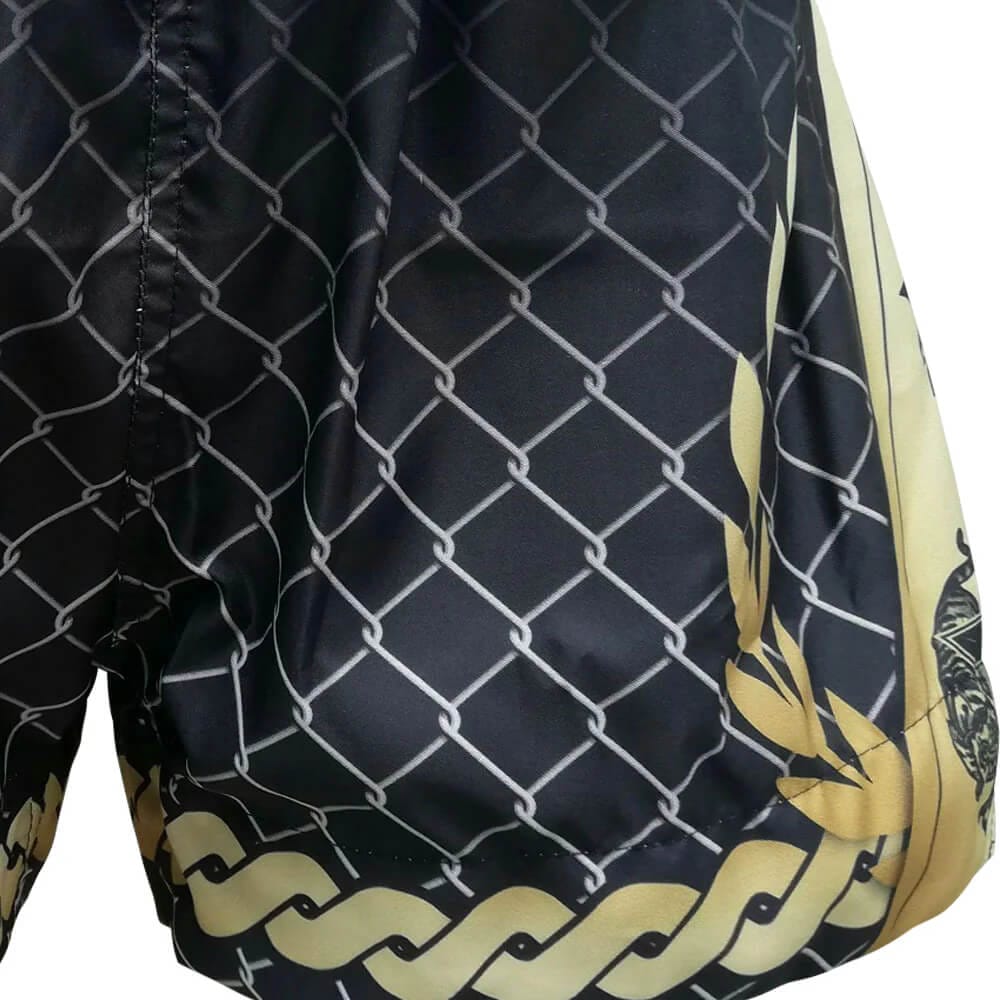 Pantaloncini Muay Thai/Kickboxing Tuff Gladiator Ancient Roman Nero/Oro per K1-Kickboxing e Muay Thai. Microfiber leggero, non si attaccano. Modello Gladiatore con frange.