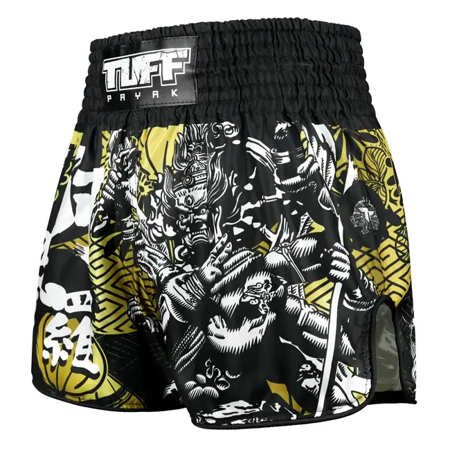 Pantaloncini Muay Thai Tuff Payak Ashura Nero/Giallo per match e allenamenti di Muay Thai e Kickboxing. Pantaloncini Made in Thailand.