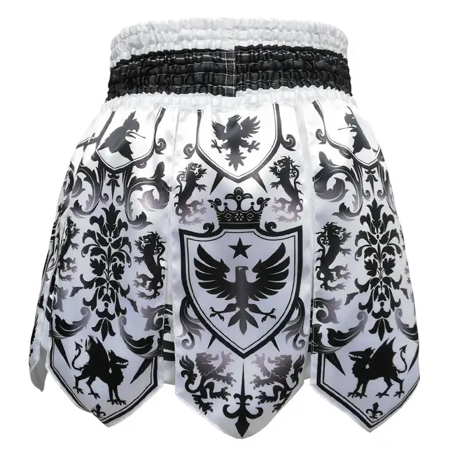 Pantaloncini Muay Thai/Kickboxing Tuff Gladiator Bianco/Nero per K1-Kickboxing e Muay Thai. Microfiber leggero, non si attaccano. Modello Gladiatore con frange