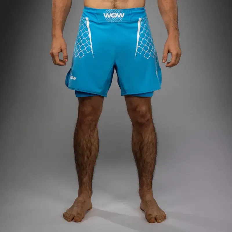 Pantaloncini MMA Venum X WOW Pacific Blue, divisa ufficiale della promotion spagnola Way of Warrior di Ilia Topuria. Ottimi anche per chi pratica Boxe, Grappling, BJJ No Gi e Kickboxing