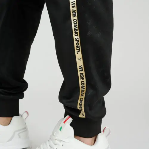 Pantalone Leone 1947 DNA Nero/Oro ABX727_01 - Boxe Kickboxing, MMA e Muay Thai. In poliestere, ottima anche per il tempo libero o la sala pesi.