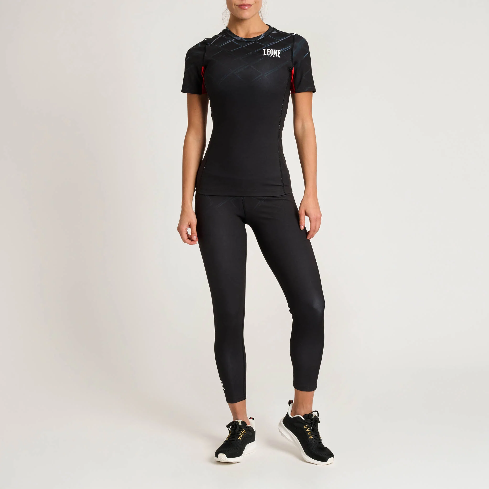 Rashguard Donna manica corta Leone 1947 MMA CAGE Grigio Scuro AB979-27 per allenamenti e match di MMA, Grappling e No Gi. T-Shirt a compressione in tessuto tecnico.